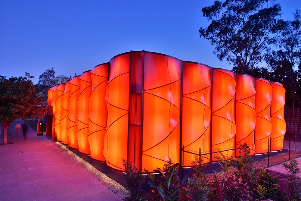 A large, bright orange modern commercial building for commercial developer sales in South Bank, Brisbane.